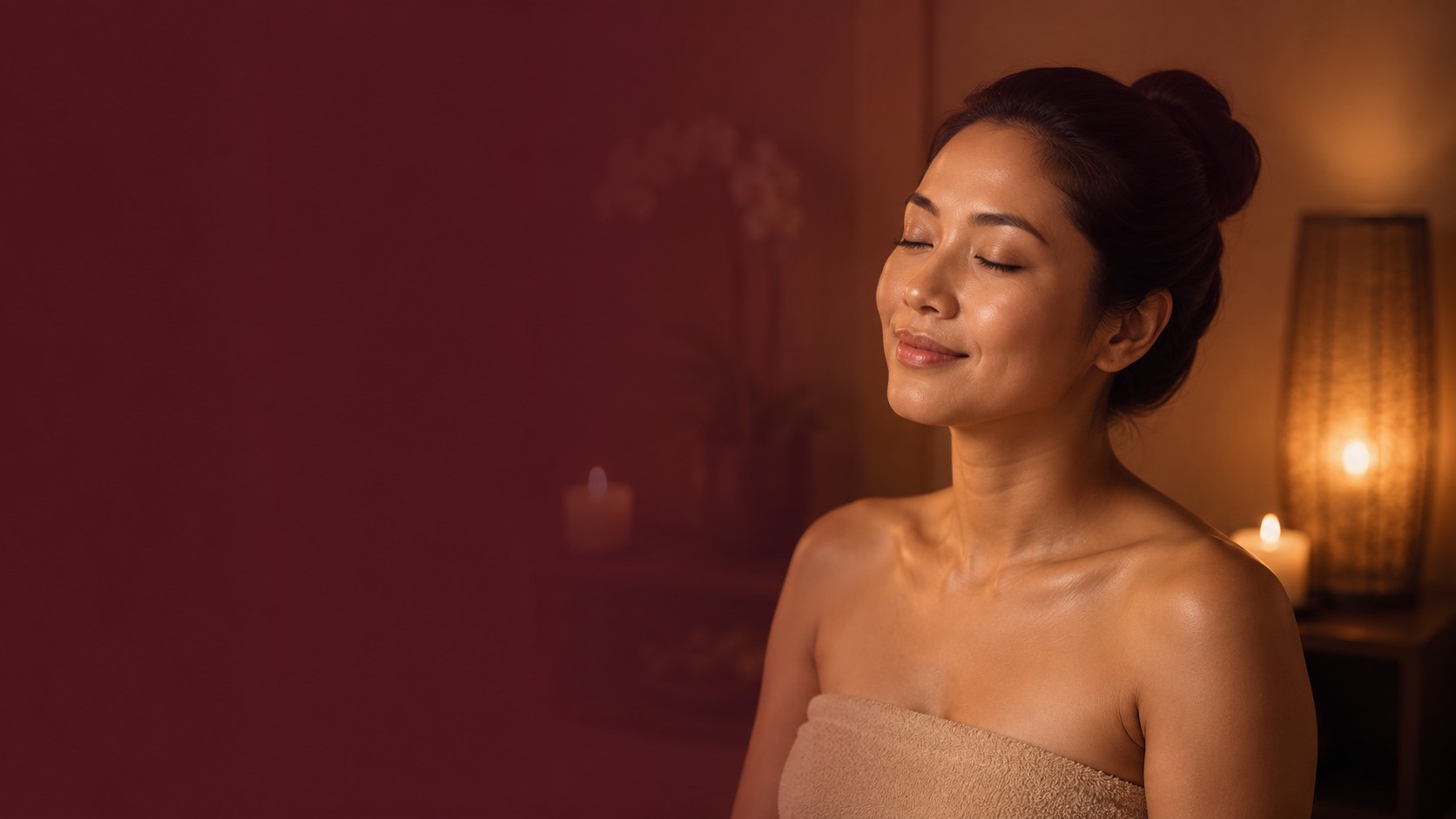 A woman relaxing in soft, warm light during a private home spa treatment